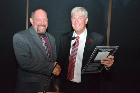 Crabtree presents Mendlik with Hall of Fame award