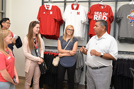 Rik Barrera, associate dean of student services and chief operating officer at the College of Business, talks about the Huskers Shop to students.
