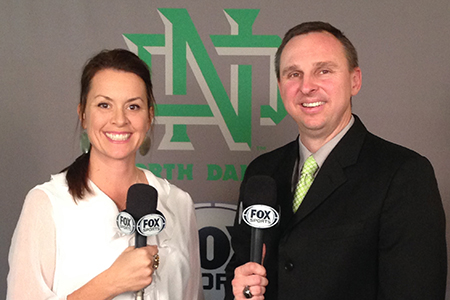 Doperalski working in the booth at a UND men's basketball game for Fox Sports North. 
