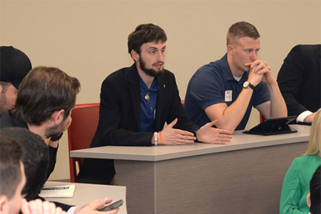 Eric Karl II, a senior accounting major from Southlake, Texas, asks panelists a question during the Executive Insights session.