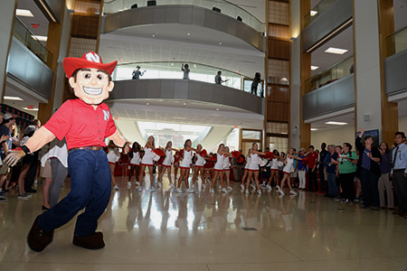 Herbie Husker joined many Nebraska cheerleaders to get the party started at the new Howard L. Hawks Hall.