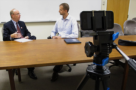 Steven Welton utilizes video production in the classroom, interviewing Nebraska MBA alum Brent Claassen.