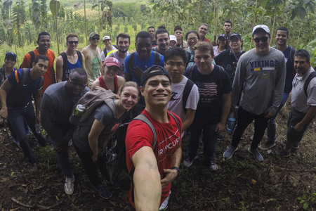 Quincey Bernard (center) with fellow students at a teak farm in Panama.