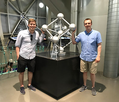 Colton and I inside the Atomium Museum with a model of the famous artifact.