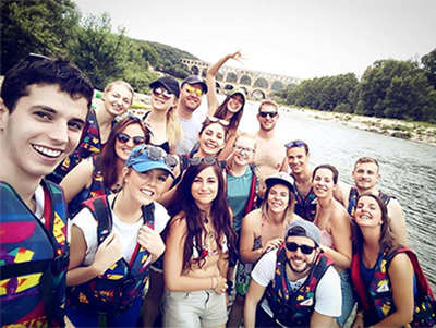 Kayaking through Pont du Gard (pictured in the back) with just a handful of my multicultural officemates!