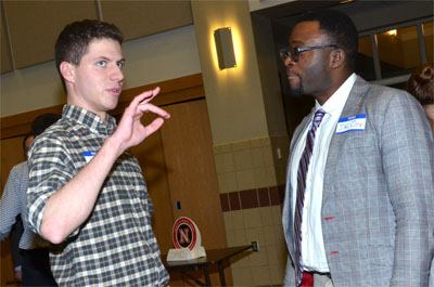 Talking to student at Meet the Professors event