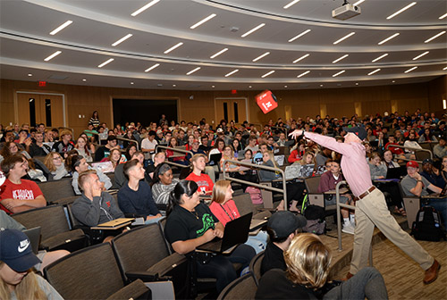 Mark Pogue, director of the Clifton Strengths Institute, lets the catchbox microphone fly in a recent BSAD class.