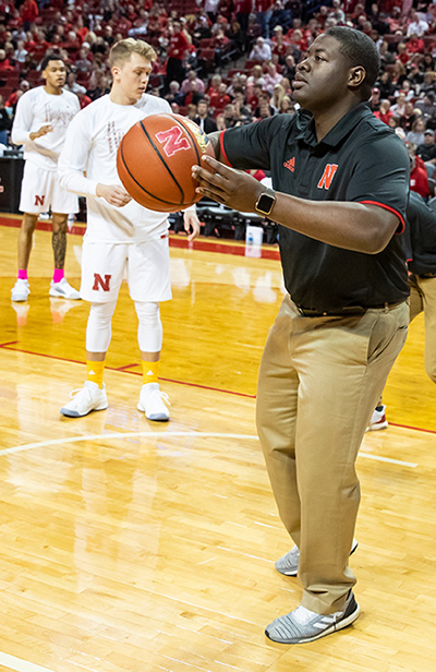 Ulysses Johnson assists the Husker
Men’s Basketball team during warmups
at the Ohio State game last year.
He continues to serve as student
manager this season.
