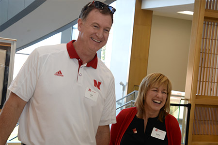 Former Husker basketball stalwart Bill Jackman with Dean Kathy Farrell at the Summit Partnership tailgate.
