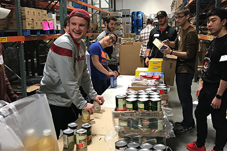 Some students spent an afternoon at the Lincoln Food Bank structuring food bags for the community. 