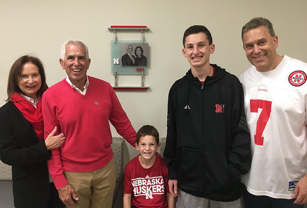 Jeri and Roger Smith (far left) visit the College of Business with their son, Brent (far right) and grandsons, Mason (left) and Dylan (right).