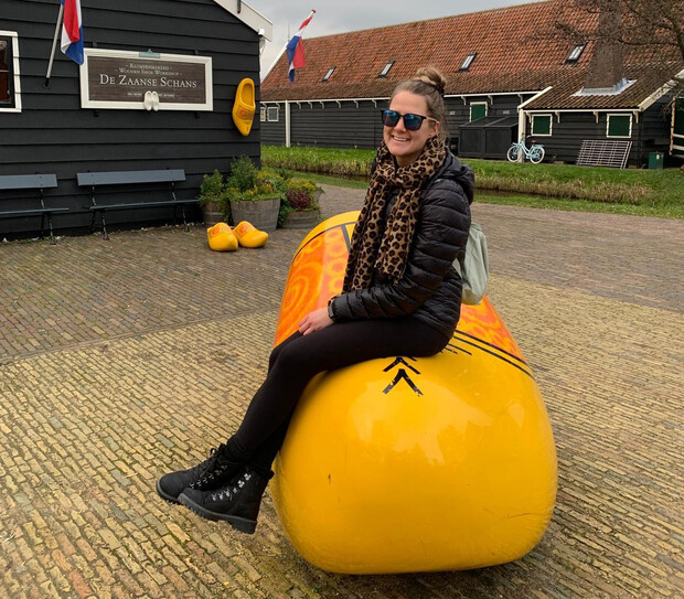 Jaylen Peters poses on an oversized wooden clog during a visit to the Netherlands.