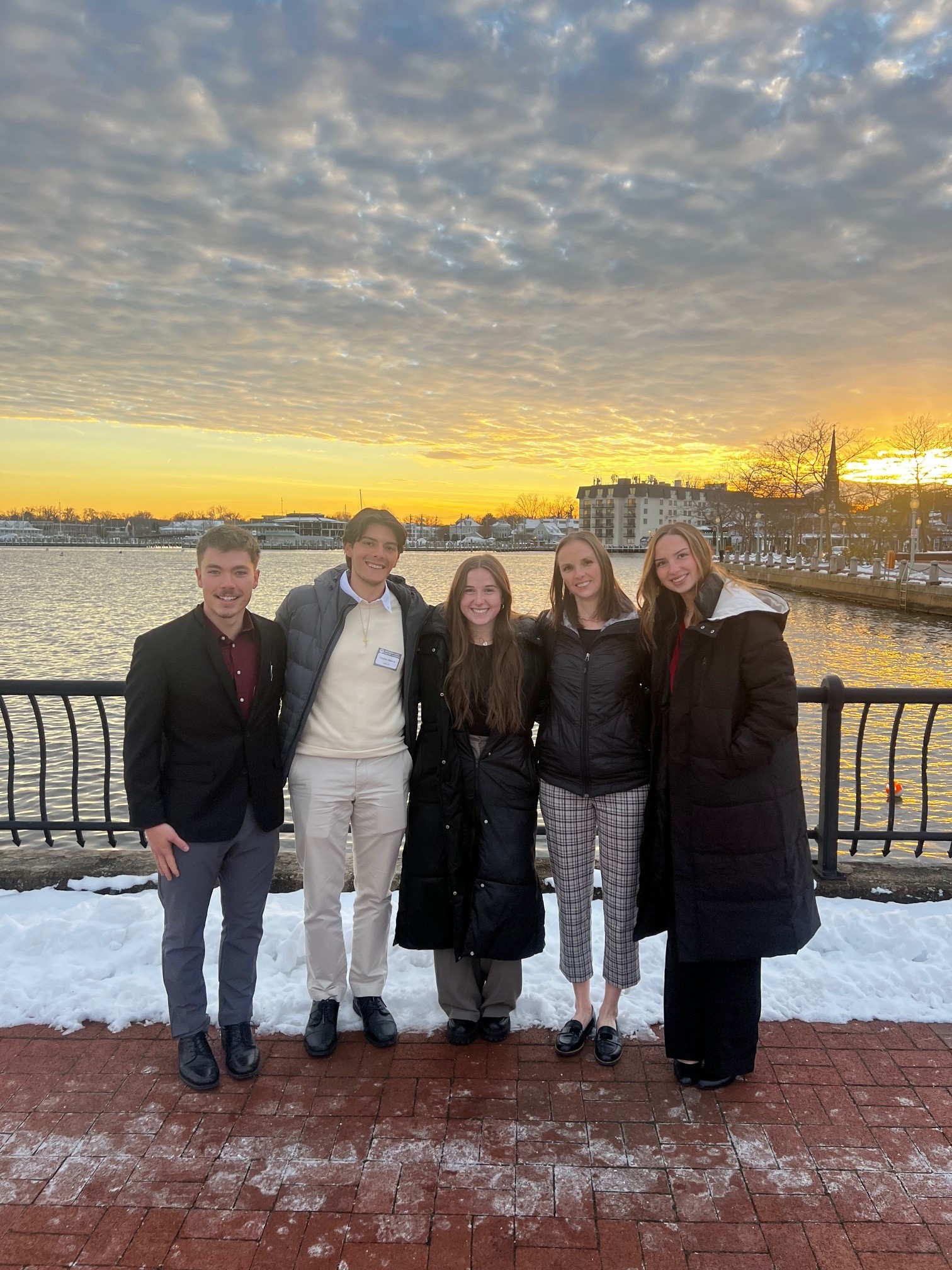 Four business majors attended the U.S. Naval Academy Leadership Conference in Annapolis, Maryland, including Deric Goldenstein, Nikolas Mainieri Mancio, Avery Plessel and Grace Timm, pictured with Rachel Wesley, Assistant Director of Business Advising and Student Engagement.