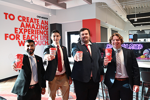 After successfully presenting their recommendations to Scooter's Coffee, Majid Al Harthy, Alessandro Boykin, Caden Vetter and Sam Pribyl sampled some of the beverages and met the company's CEO. 