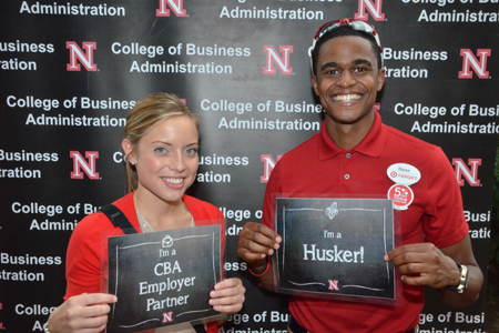 Students posing in front of CBA backdrop at 2014 Back to School Bash
