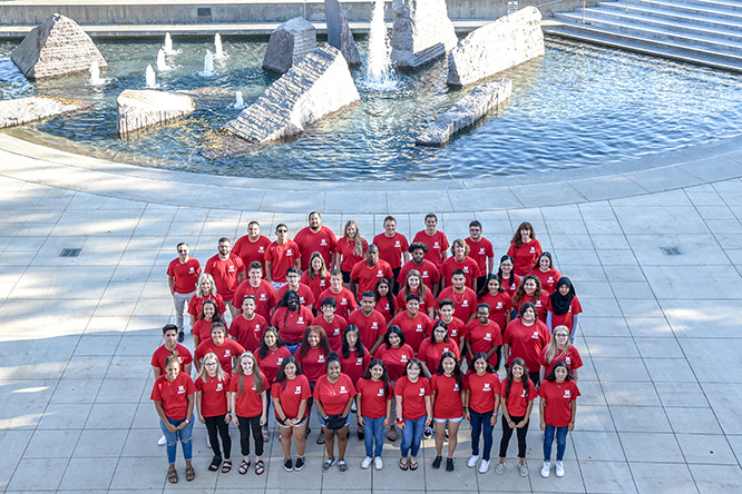 DREAMBIG students pose for a group photo at the Broyhill Fountain on campus.