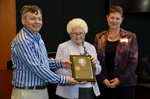 Cushing with Connie and Terri Vaughan accepting honor for the late Emmett J. Vaughan