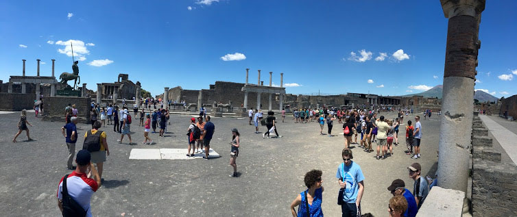 Pompeii City Square with Mt. Vesuvius in the background. The People of Pompeii didn't know that Mt. Vesuvius was a volcano at the time. The town square was built to frame the mountain, not knowing that the ashes from the same mountain would later destroy their civilization.