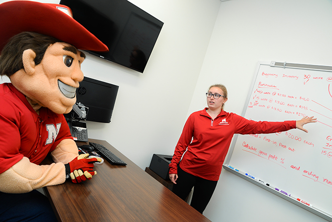 Natalie Sneed sees how tutoring can help anyone, even Herbie Husker. 