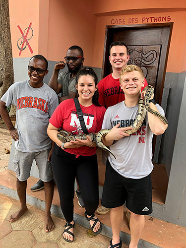 The Huskers at the python temple in Benin.