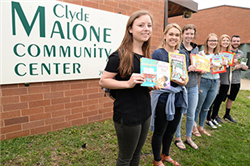 Honors Academy Students Encourage Reading at Malone Center