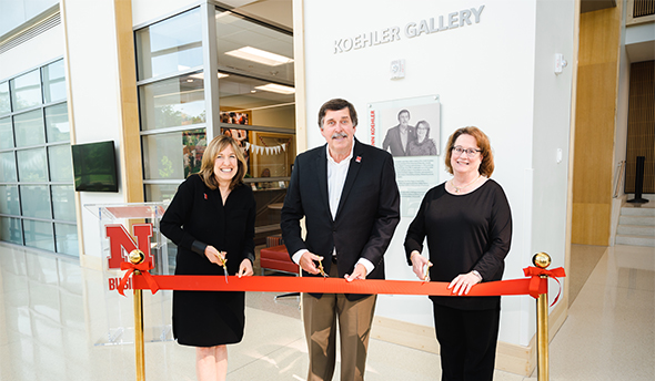 In recognition of their gift and longtime support of the college and its students, the College of Business named the vaulted, multistory entryway on the east side of Hawks Hall the Paul H. and Mary Ann Koehler Gallery during a dedication ceremony, May 26.