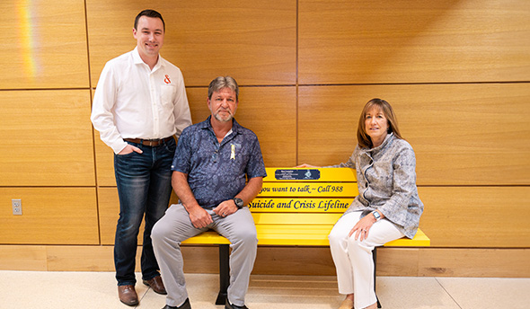 A yellow bench in honor of the late Ben Longley was unveiled in Howard L. Hawks Hall at the College of Business on Sept. 26