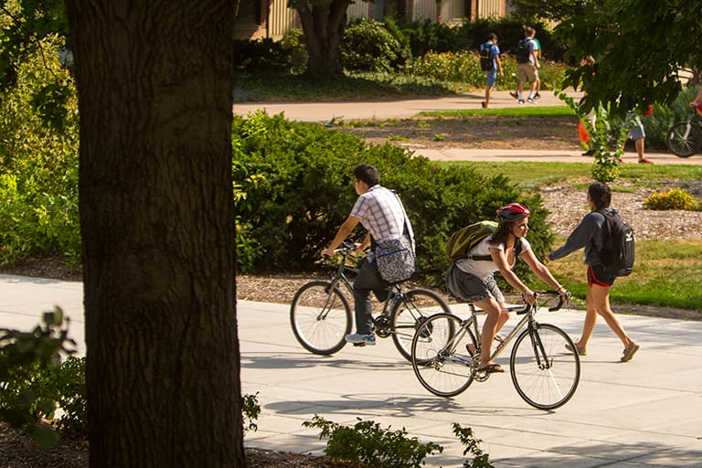 people biking on campus.