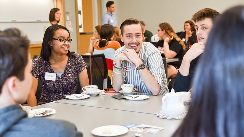 Students talking at round table event