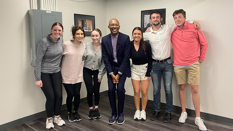Group poses at American Marketing Association meeting.