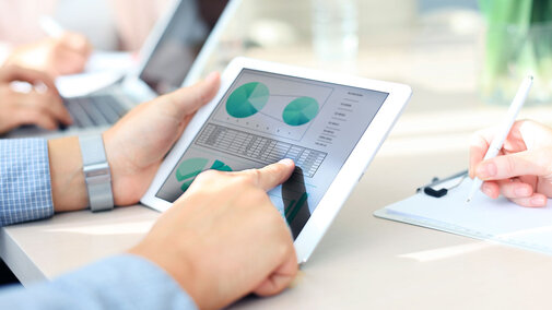 hands working on an ipad