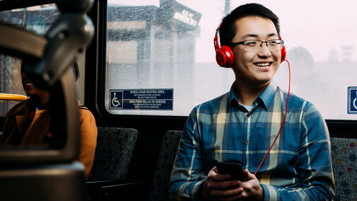 Man sitting on a bus