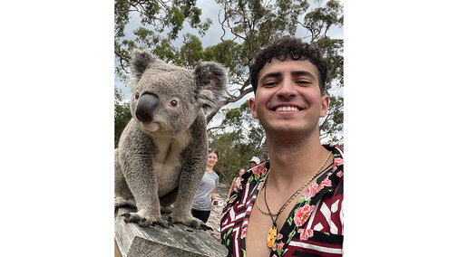 student with a koala