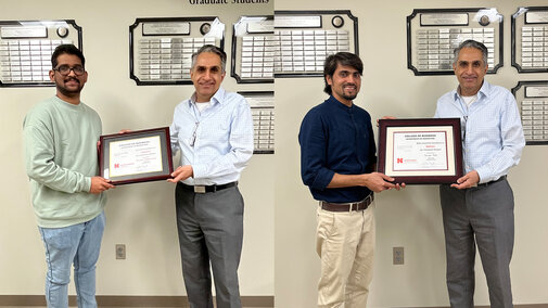 Two individuals each receiving a framed certificate from another person in an indoor setting.
