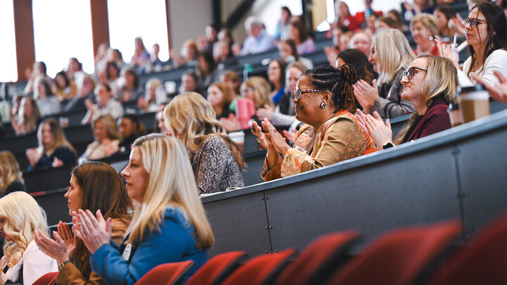 women lead conference attendees