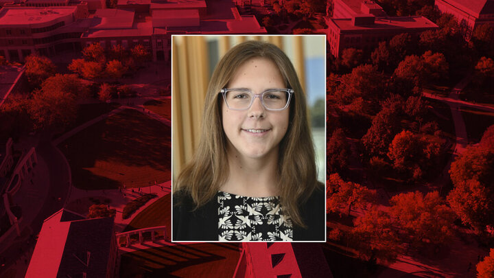 Portrait of Abby with university in background