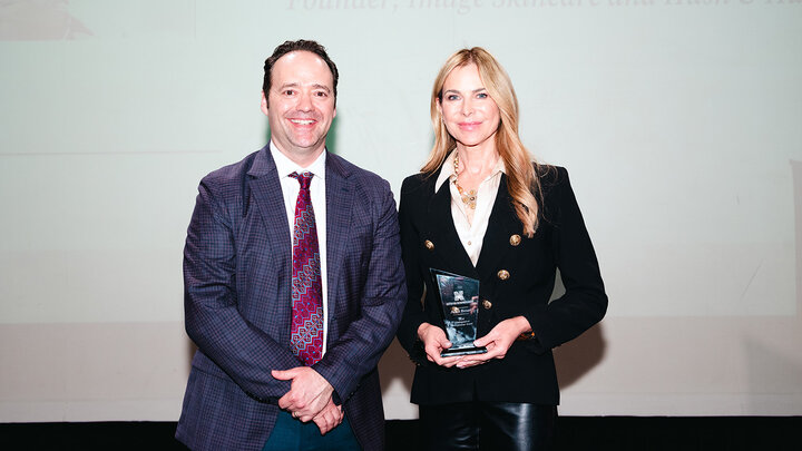 Sam Nelson presents the new Distinguished Entrepreneur Award to Janna Ronert