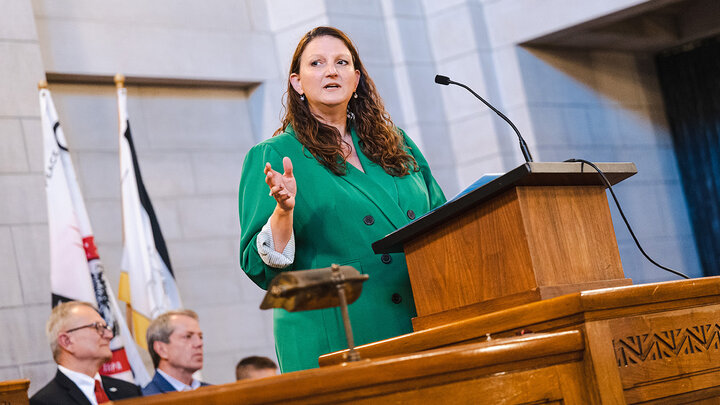 Jennifer Davidson talking at podium.