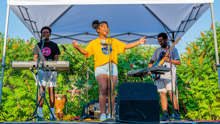 Students at the College of Business experienced a study abroad trip to Rwanda through their computers during a virtual global experience course held this summer. The course concluded with a concert from the Live Lyve Band, a Rwandan band comprised of university students.