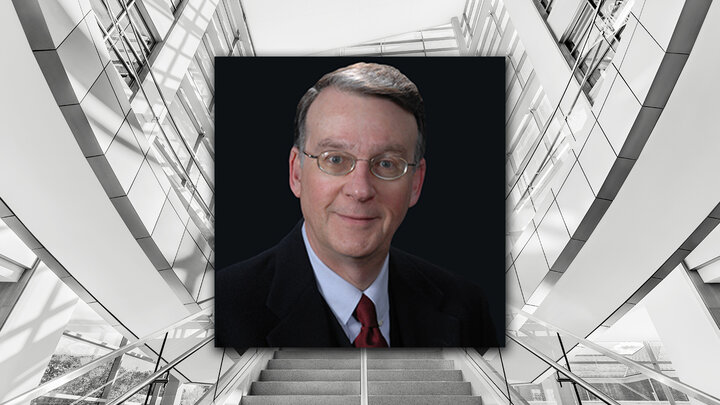 A modern staircase with glass railings, a blurred portrait superimposed in the center.