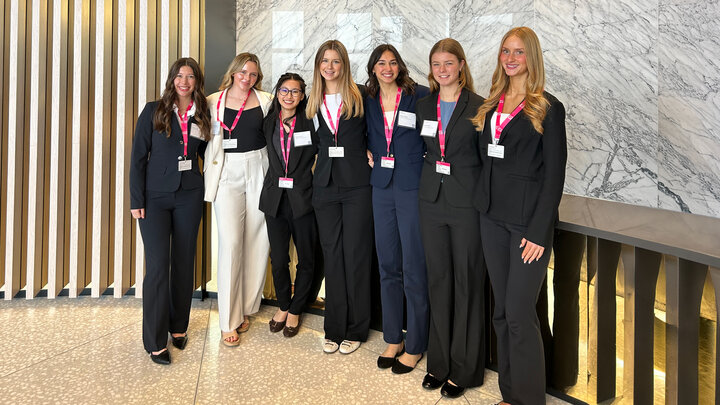 group of women standing together posing