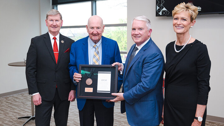 Rhonda and Howard Hawks receiving being presented the Regents Medal