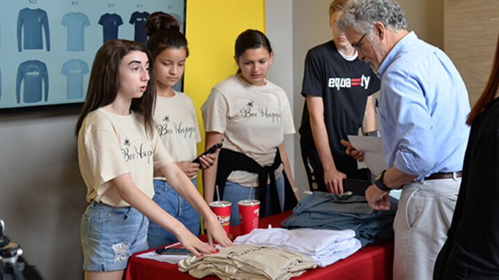 Future Builders selling shirts at a pop-up shop