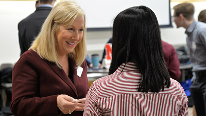 Student networking with Employer