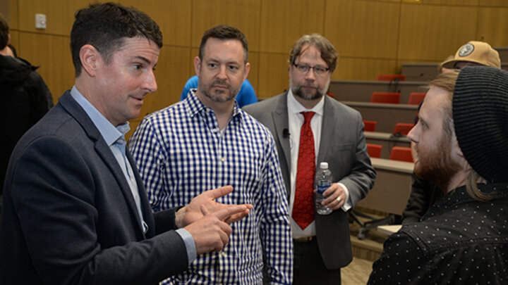 Jon McNeill, Joe Petsick and Matthew Wegener engage with students