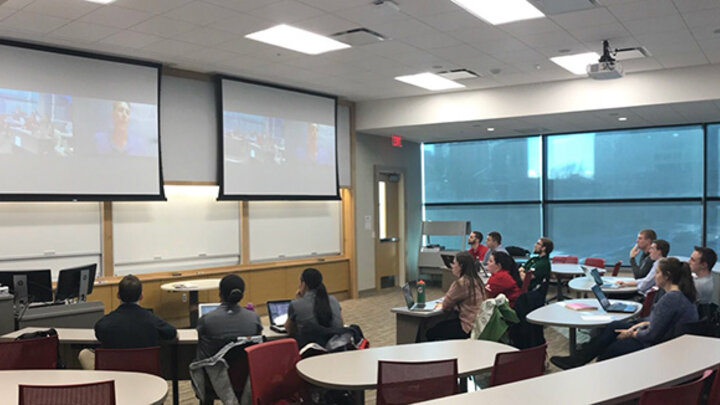Students listening to Austrailian speaker over Zoom 