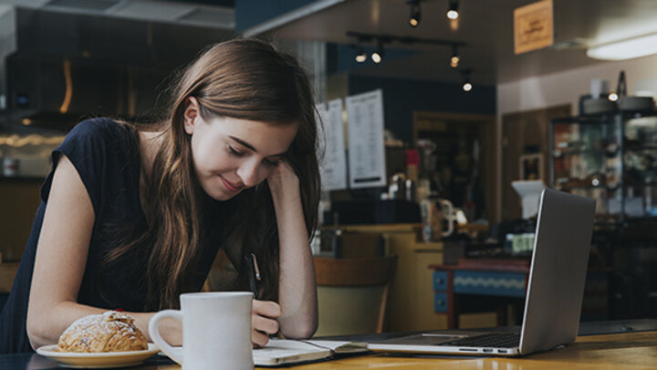 Student in Coffee Shop studying
