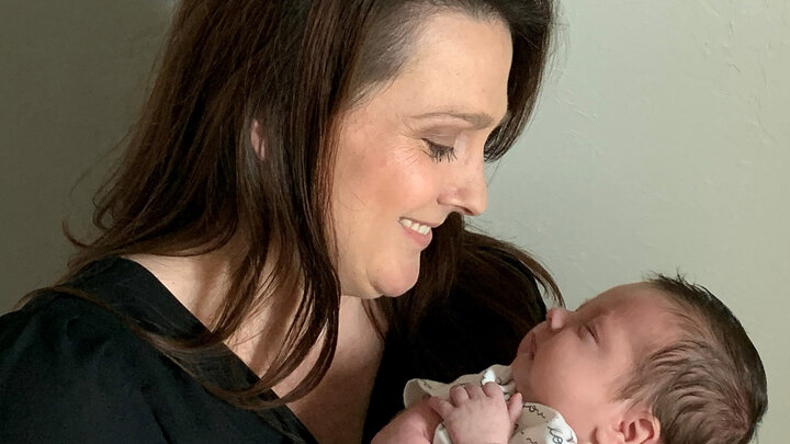 Dr. Brandi McManus holds her first child, Donovan, from her home in Oklahoma.