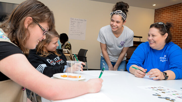 Lizz Whitacre, '17, kicked off the Girl Scouts Girls Shine Brighter Challenge to spark their fire for entrepreneurship.