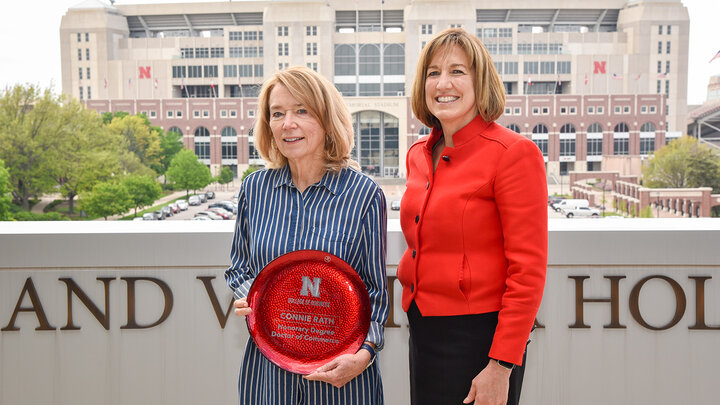 Dean Kathy Farrell presented Connie Rath, ’70 & ’71, president of the Clifton Foundation, with a Nebraska Business gift.
